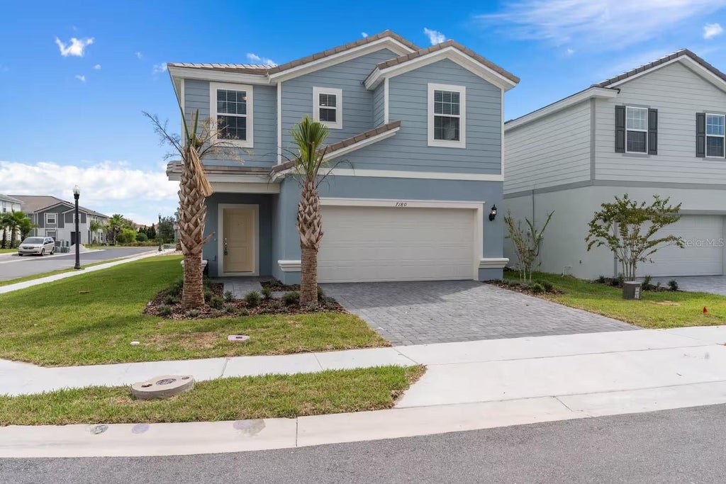 Photo of 7180 Oakmoss Loop, Davenport, FL 33837 (MLS # O6449287)
