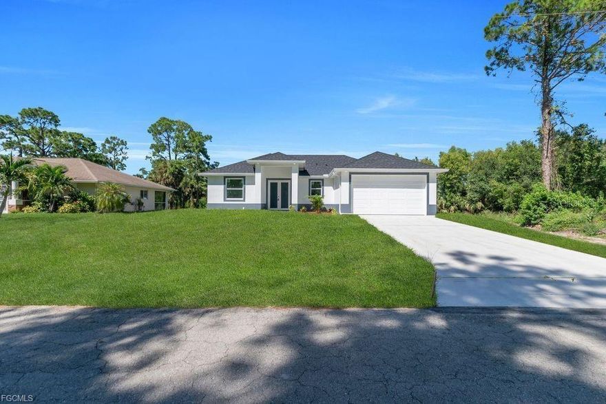 Welcome to an exceptional new construction residence in the heart of Lehigh Acres, where contemporary luxury meets thoughtful design. This impeccably crafted home presents an enticing blend of sophistication and practical living spaces, offering three bedrooms and two well-appointed bathrooms. Step through the elegant double-door entry into a home that exemplifies modern Florida living. The great room design creates an impressive sense of openness, seamlessly connecting living spaces and establishing an ideal environment for both entertaining and daily life. The heart of this home is its beautifully conceived kitchen, featuring a traditional eat-in design enhanced by a generous island that doubles as a casual dining space. Culinary enthusiasts will appreciate the complete suite of new stainless steel appliances, including a refrigerator, dishwasher, microwave, and range. The kitchen's sophisticated aesthetic is elevated by premium quartz countertops, which extend into the bathrooms, maintaining a cohesive design throughout. The primary bedroom suite stands as a private retreat, boasting a spacious walk-in closet and an elegant bathroom with dual sinks. Two additional bedrooms offer comfortable accommodations for family members or guests, while the second full bathroom ensures convenience for all. Throughout the residence, premium porcelain tile flooring creates a seamless flow, reflecting light and contributing to the home's bright, airy atmosphere. All windows feature stylish zebra blinds, adding a touch of modern elegance while offering versatile light control. Safety and durability were paramount in the design, with impact windows and doors providing peace of mind during Florida's seasonal weather. The covered lanai extends the living space outdoors, offering a serene setting for morning coffee or evening relaxation. Professional landscaping enhances the front yard, creating immediate curb appeal and a welcoming approach to your new home. This residence's location proves equally impressive, positioned just blocks from Lee Boulevard and offering swift access to Fort Myers. The neighborhood boasts exceptional educational opportunities, with schools and a public library nearby. Daily conveniences are equally accessible, with shopping and dining options within easy reach. Notably, this property sits outside designated flood zones, offering additional peace of mind. This new construction represents more than just a house; it's an opportunity to embrace a lifestyle where comfort meets convenience, where modern amenities blend seamlessly with practical living, and where every detail has been carefully considered to create an exceptional living experience. Don't let this remarkable opportunity pass you by - schedule your private showing today and step into your future home.