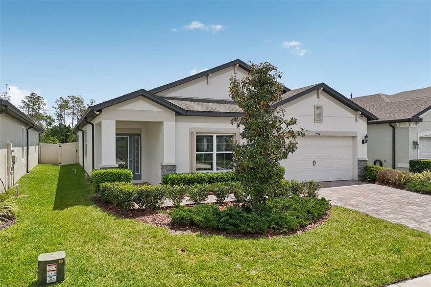 Land O’ Lakes Gem with NO CDD, LOW HOA and Over 2,100 Sq Ft! Welcome to 7114 Gulf Cypress Avenue in the highly desirable Ehrens Mill community of Land O' Lakes, featuring a LOW HOA and NO CDD. Offering exceptional value along with a beautifully built 2022 MI Homes Newport II, one of the builder’s most popular open concept floor plans. This move in ready home combines modern design, energy efficiency, and peace of mind in one of Pasco County’s fastest growing areas. Upon arrival, you’re greeted by an inviting front glass entry door that welcomes you inside with natural light and a warm first impression. Boasting over 2,100 square feet, this spacious 4 bedroom, 2 bath home with a flex room and 2 car garage offers a highly sought after split floor plan ideal for privacy and functionality. From the covered entry, you’re welcomed into a bright foyer leading to a versatile flex space that is perfect for a home office, playroom, or potential 5th bedroom conversion. The heart of the home is the open concept kitchen, featuring a large center island, abundant cabinetry, and generous counter space perfect for entertaining. The kitchen flows seamlessly into the dining area and expansive family room, creating the ideal layout for gatherings and everyday living. Tucked privately in the rear of the home, the spacious owner’s suite offers a true retreat with a walk in closet, dual vanities, a garden tub, and a separate walk in shower. Additional bedrooms are positioned along a separate hallway with easy access to a full bath and laundry room, enhancing the home’s functional layout. This home stands out with premium upgrades that today’s buyers are actively seeking, including hurricane shutters on the front windows and rear sliding glass doors, full perimeter waterproofing for added protection, and a system of six high resolution hardwired security cameras delivering both safety and long term value. Built with durable concrete block construction and equipped with a modern HVAC system, this home offers energy efficiency and low maintenance living. The attached 2 car garage and well maintained lot complete the package. Located just minutes from top rated schools, new shopping centers, restaurants, and major highways, this home provides easy access to Tampa, Wesley Chapel, and surrounding areas, making it ideal for commuters and families alike. If you're searching for a newer construction home in Land O’ Lakes with NO CDD, low HOA, modern upgrades, and a functional open layout, this is the one.