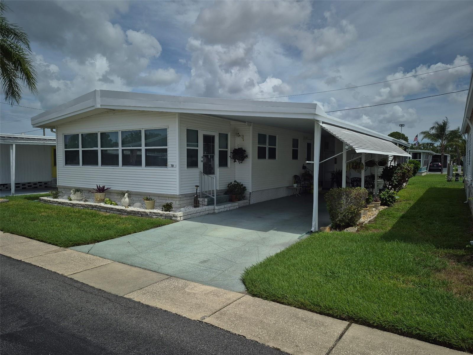 Well-maintained, Fully Furnished Double Wide 1056 Sq. Ft. 2 Bedroom 2 Bath home with bonus room is ready for you to move in, just bring your tooth brush! Home has new windows throughout, window treatments to include curtains and vertical blinds. The kitchen comes with appliances including refrigerator, stove and microwave. The master bedroom is large with extra closet space. Master bath has a walk-in shower. Second bath has a tub/shower combination. Kitchen is open to the formal dining area. Bonus room is open to the Dining Room and Living room which makes it great for entertaining. Washer and dryer are in the storage shed. Carport large enough for two vehicles. Located in a golf-cart community. Make an appointment to come see this beautiful home.
Lake Highlander 55+ Mobile Home Park offers:
A clubhouse, lending library, billiard and game room, geothermal heated pool, spacious lanai, laundry facility, shuffleboard courts, park office, and a beautiful lake.
Activities include golf, bowling, and shuffleboard leagues, social dinners and dances, bingo, game nights, exercise programs, organized outings, and weekly coffee hour.