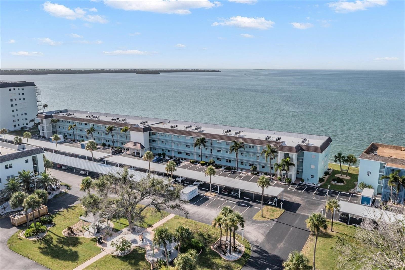 A beautifully maintained 2-bedroom, 2-bath waterfront condo with ELEVATOR nestled off the Dunedin Causeway in a desirable 55+ community! Enjoy the perfect blend of comfort and convenience in this move-in ready home featuring serene water views. 2010 Hurricane windows with a transferable lifetime guarantee. All new screens are coming soon. Comes fully furnished and stocked. Ideally located just minutes from beaches, shopping, dining, and the vibrant heart of Dunedin. This community offers a resort-style lifestyle with fantastic amenities including a heated pool, clubhouse, fitness center, and an active calendar of social events. Come check it out whether you're looking to relax or stay engaged. The milestone inspection was passed and no assessment was required, the association is fully funded. The HOA takes care of the roof and replaced it this year and maintains the water heater located outside the units.