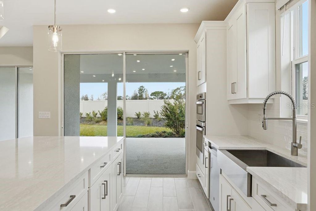 Photo of 3863 Figliolia Way, Wesley Chapel, FL 33543 (MLS # TB8451200)