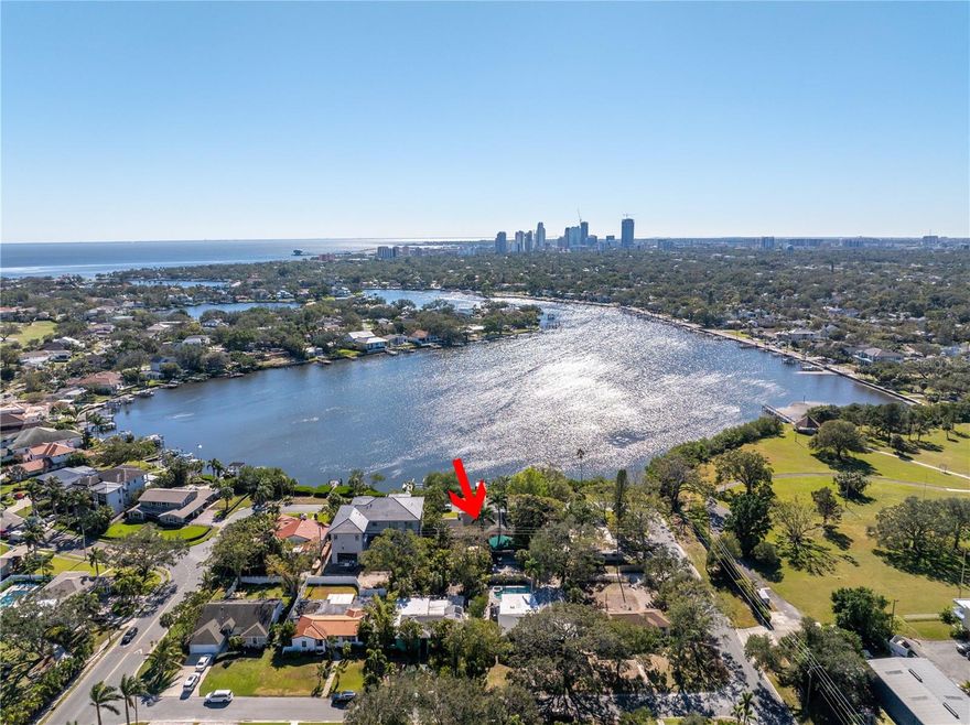BUILD YOUR DREAM HOME with ONE OF A KIND WATERFRONT VIEWS OF DOWNTOWN ST. PETE! 95 X 127 lot in PRIME Coffee Pot Bayou LOCATION with RARE WATERFRONT SKYLINE VIEWS! This is not your traditional waterfront lot! Tucked off Monterey Blvd, just steps to the Vinoy Golf course, you'll find 323 Coffee Pot Drive nestled on a PRACTICALLY PRIVATE street (almost no through traffic) with only four homes facing the incredible skyline of downtown St. Pete. A fantastic opportunity to custom build your future home. Featuring almost 100ft of mangrove protected waterfront paradise, abundant with wildlife and perfect for enjoying the peace and tranquility of bayou living. Fishing, kayaking, bird watching and manatee sightings are all a part of daily life, as well as taking in the incredible sunsets from your own private dock. Oasis designed saltwater pool constructed in 2021 with gorgeous travertine pavers and lush landscaping. Build around to suit or start fresh! There are tons of possibilities but not many lots available with this kind of privacy and view!