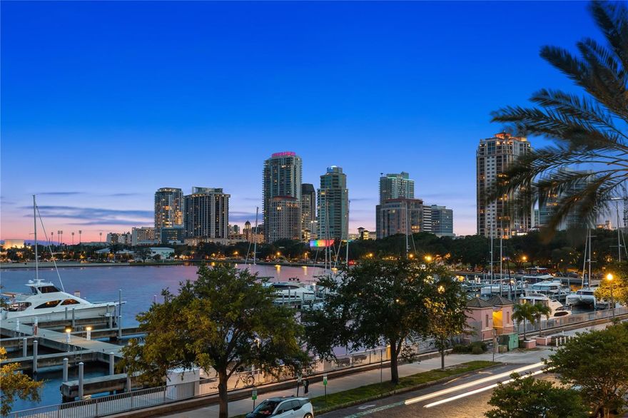 A RARE OPPORTUNITY to own a completely renovated City Home that overlooks the Vinoy Basin & marina with views of the waterfront, St. Petersburg Pier and vibrant downtown! This light and bright luxurious residence boasts terraces on every floor, a private elevator, a two-car garage with tandem parking for up to 4 cars, 3 spacious bedrooms all with en-suite bathrooms, plus a den/office, for a total of 3,500+ square feet of living space. Greet your guests in the private courtyard for a warm and welcoming feel and entertain in the spacious kitchen with an island and peninsula open to the dining and living room with water views. The expansive primary suite features a sitting area with water views from the bedroom and bath, a private terrace, a walk-in shower with dual shower heads, dual sinks, lots of counter space, a separate water closet and an oversized custom walk-in closet and dressing room. Adjacent to the primary suite is a dedicated laundry room with sink, a home office or den, and a second large bedroom also with a sitting area, walk-in closet and en-suite bath. The guest suite on the third floor features a reading nook and a coffee/wine bar with access to the rooftop terrace, making for a perfect set-up to enjoy the sunrise, sunset or the city lights. Start living the Florida lifestyle in this elegant community with amenities that include a 24/7 manned guard house, great on-site management, a fitness center, two heated pools/spas, a club room with a catering kitchen, a social room for card games and guests parking spaces (a rarity in downtown). Schedule a private showing to view this move-in ready home with an easy stroll to the waterfront parks, restaurants, shops and museums in the heart of St. Pete.