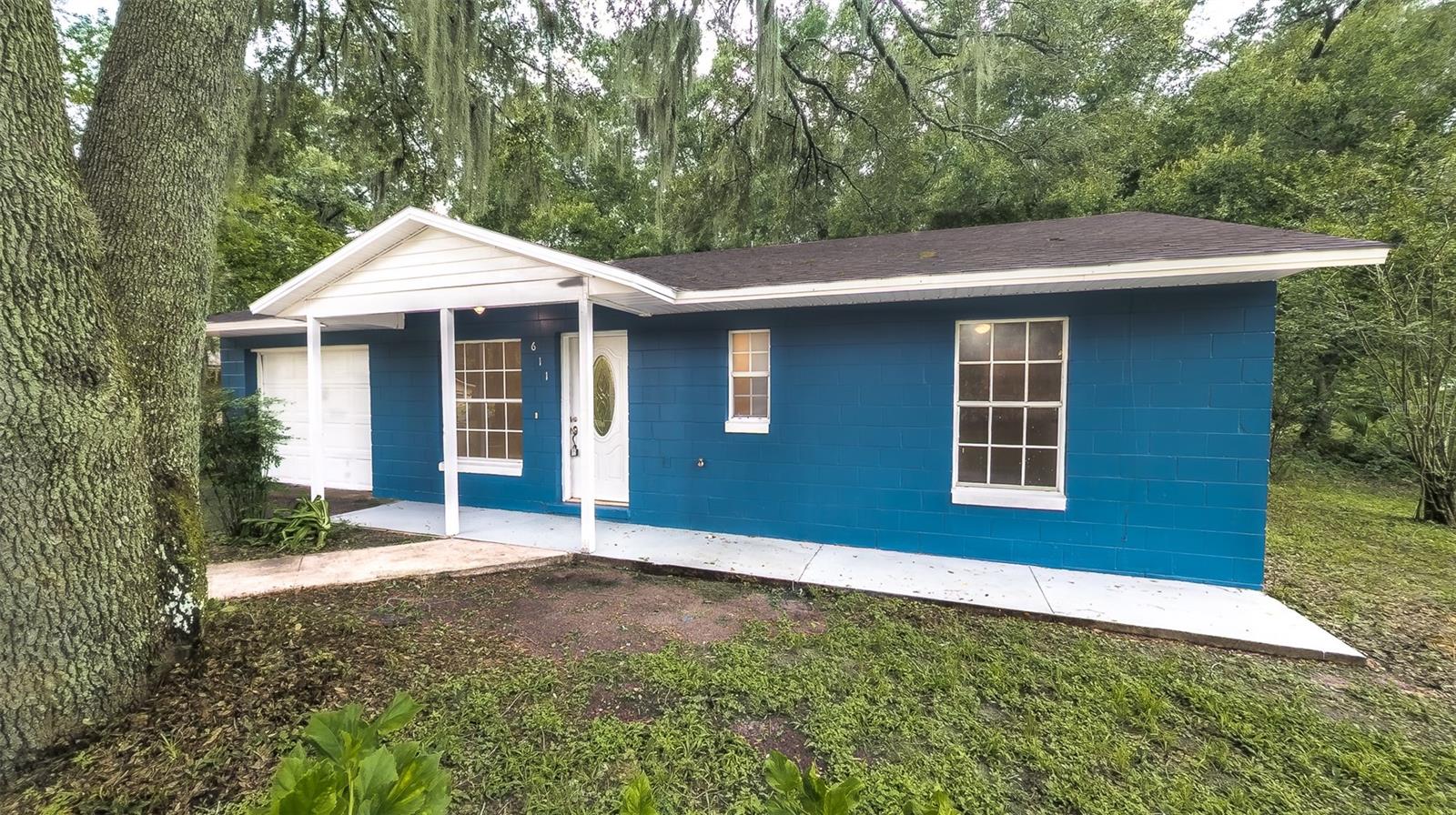 Welcome to your beautifully renovated retreat in the heart of Wildwood! Just minutes from The Villages, this charming 3-bedroom home sits on an oversized lot with plenty of space to entertain, garden, or simply relax under the Florida sun. Step inside and enjoy peace of mind with a brand-new roof and new HVAC system, plus fresh interior and exterior paint, luxury vinyl plank (LVP) flooring, a fully updated kitchen, and a stylishly remodeled bathroom. Whether you're looking for a cozy place to call home or a smart investment in a fast-growing area, this gem is ideally located near shopping, dining, golf, medical centers, and all the amenities The Villages has to offer. Motivated seller – bring your offer today and make this move-in-ready home yours!