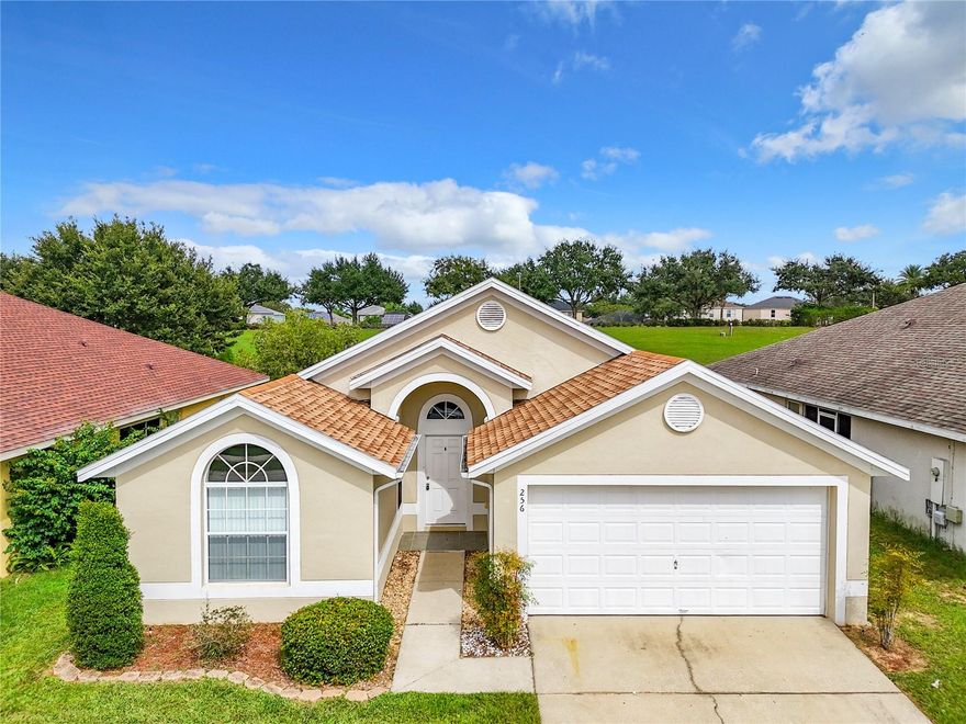 Discover your dream home in the desirable community of Legacy Park. This stunning 4-bedroom, 2-bath residence is a true gem, boasting no rear neighbors and an exquisitely landscaped exterior. Step inside to a bright and airy interior with vaulted ceilings that create an inviting atmosphere. The combined living room and dining area offers seamless access to the oversized backyard, perfect for outdoor gatherings and relaxation. The gourmet kitchen is a chef's delight, equipped with stainless steel appliances, ample storage cabinets, and sleek solid surface counters. The spacious master bedroom features a walk-in closet and an ensuite bath with a vanity sink, garden tub, and a separate shower stall for your comfort. Whether you're looking for a primary residence or an investment opportunity, this property is ideally located close to Disney, major attractions, shopping centers, and restaurants. With newly installed ROOF in 2022. Don't miss your chance to make this house your home and enjoy the Legacy Park lifestyle.