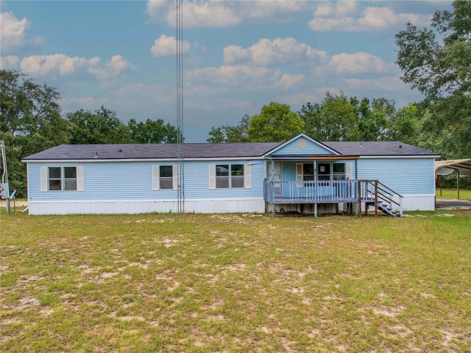 Price improvement! Discover the potential in this spacious manufactured home with on over 1 acre! Tucked away in a quiet, private setting, this property offers endless opportunities for the right buyer looking to create their ideal retreat, retirement escape, or smart investment.
Offering ample square footage of interior space and a new roof, this home is the perfect canvas for your personal touch. Outside, you’ll find a large detached storage garage, aluminum carport, and an additional outbuilding—ideal for storing 4-wheelers, boat, and all your toys. Whether you're into outdoor adventures or simply need extra space, this property delivers tons of storage and room to grow. With its flexible use and potential, this is an excellent opportunity to own a slice of Florida tranquility. Bring your vision and make it your own!
All information recorded in the MLS is intended to be accurate but cannot be guaranteed, buyer advised to verify. Sold As-Is.