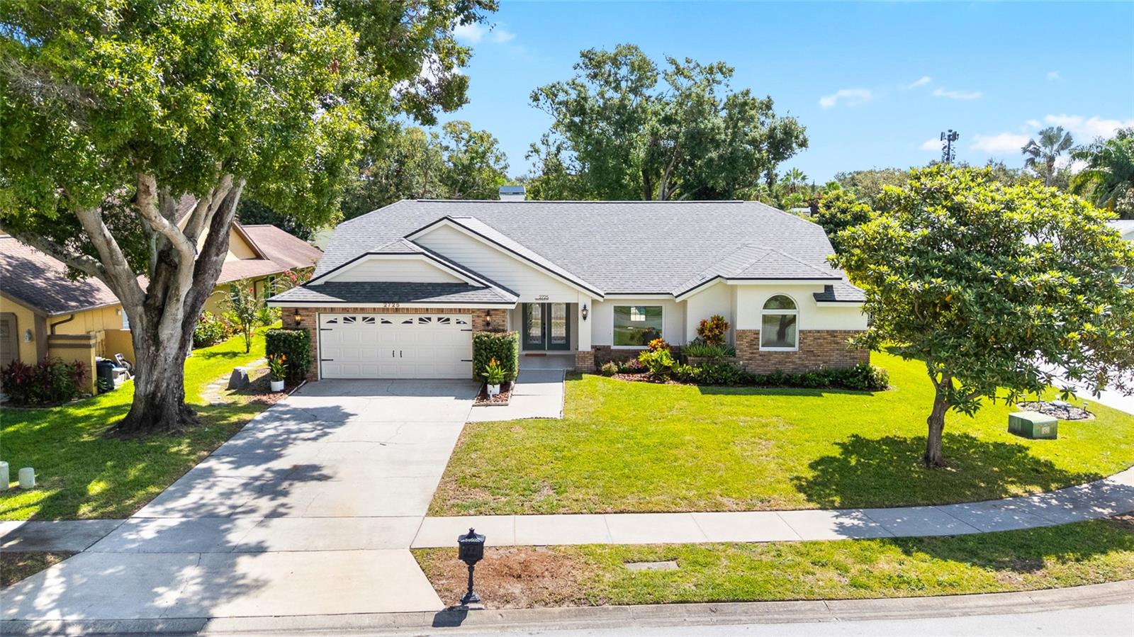 Welcome to this 4 bedroom, 2.5 bathroom, 2 car garage, POOL home in WATERFORD CROSSING! This Dunedin/Palm Harbor home (located inside the city limits of Dunedin) has been reimagined with all new high end finishes and an open concept design that will make entertaining a breeze. The all new kitchen features soft close solid wood cabinets, Carrera quartz stone, and beautiful stainless steel appliances. The master bathroom has been redone in warm tones, with a full 5x7 walk in shower, luxury delta fixtures, and HIS AND HERs walk in closets AND double 60" vanities. This gem is located in Flood Zone X, with a new ROOF in 2025, water heater 2024, and AC 2024, you can move in with peace of mind. Sitting on over a quarter acre in a quiet cul-de-sac just minutes from downtown Dunedin or the sparkling beaches of Clearwater, amongst so many other amazing amenities, there'll be no shortage of fun to have!