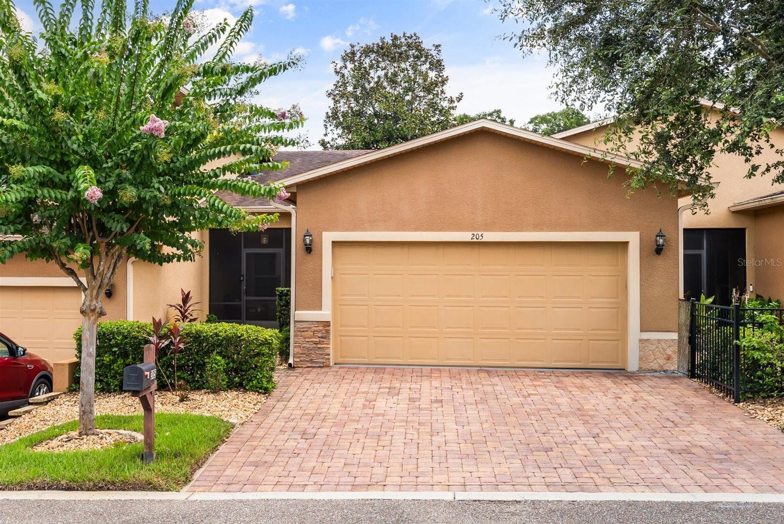 Welcome to this one-story, two-bedroom, two-bath townhome located in the private, gated community of Carriage Homes. This charming residence features a cozy front porch, a stylish kitchen with white cabinetry, stainless steel appliances—including a glass top stove with regular/convection oven—and granite countertops. The entire home boasts matching luxury vinyl flooring for a seamless, modern look. Enjoy worry-free living with an HOA that covers all exterior maintenance, including landscaping, roof shingle replacement, exterior painting, plus internet and TV services. Ideally situated just minutes from delightful downtown DeLand, grocery stores, and pharmacies, with quick access to I-4 for an easy drive to Orlando, world-famous theme parks, or beautiful Florida beaches. Don’t miss out—call today to schedule your private showing before it’s gone!