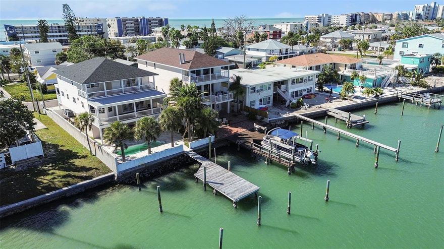 Experience refined coastal luxury with sweeping views of the Gulf of Mexico. This elevated waterfront residence offers 3 bedrooms, 3.5 baths, TWO primary suites, an elevator, and a 3-car garage, thoughtfully designed for upscale living. The open-concept main level features a chef’s kitchen flowing seamlessly into the living and dining areas, all framed by breathtaking water views and abundant natural light.
The third-floor primary suite is a private retreat with its own balcony, two walk-in closets, and a spa-style bath with jacuzzi tub and walk-in shower. A second primary suite offers Gulf views, private balcony, and en-suite bath. Additional highlights include two wood-burning fireplaces, luxury vinyl flooring, and surround sound.
Enjoy effortless waterfront living with a brick paver yard, mature palms, private dock, and 10,000-lb boat lift with quick Gulf access. Watch dolphins, fish from your dock, and enjoy Madeira Beach fireworks from home. Recent updates include a 2023 roof and water heater, updated HVAC, fresh interior paint, dishwasher and refrigerator (2025). Just steps to the beach and minutes to John’s Pass, dining, and shopping—this is truly a boater’s paradise.