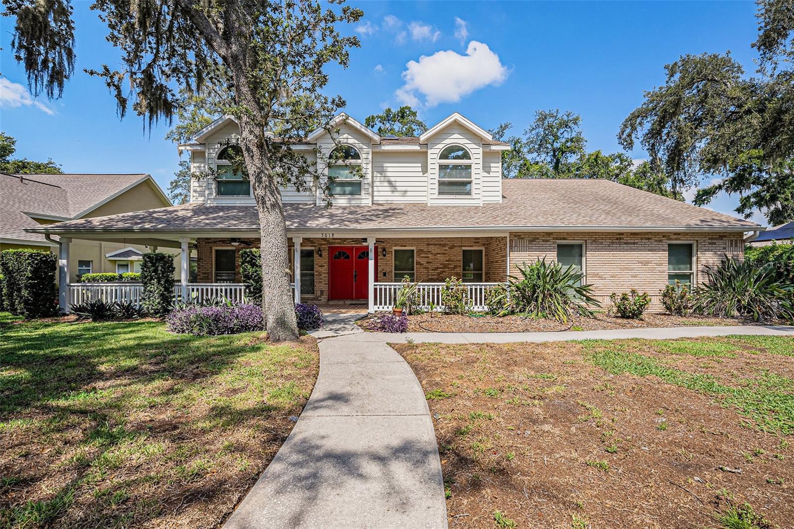 Gorgeous two story traditional home. Wonderful brick exterior and wrap around porch. 5 bedrooms and 4 full baths. Special feature to home is a spacious first floor in law suite with both a private entrance and an interior entrance, which includes generous room size with custom built shelving, full ensuite bath and walk in closet. Owner suite on second floor has large ensuite bath, walk in shower with seat and separate tub plus large walk in closet. Expansive eat in kitchen with wood cabinets, custom counters, brick hearth, double ovens and walk in pantry. Spacious separate formal living and dining rooms. Large family room with fire place and built in shelving. Indoor utility room with a triple stainless steel sink and custom cabinets and storage. Screened pool with covered seating and outdoor fireplace. Fenced backyard, irrigation system, gutters and exterior security cameras. 3 AC units. On demand hot water heater. MORE PHOTOS COMING SOON!