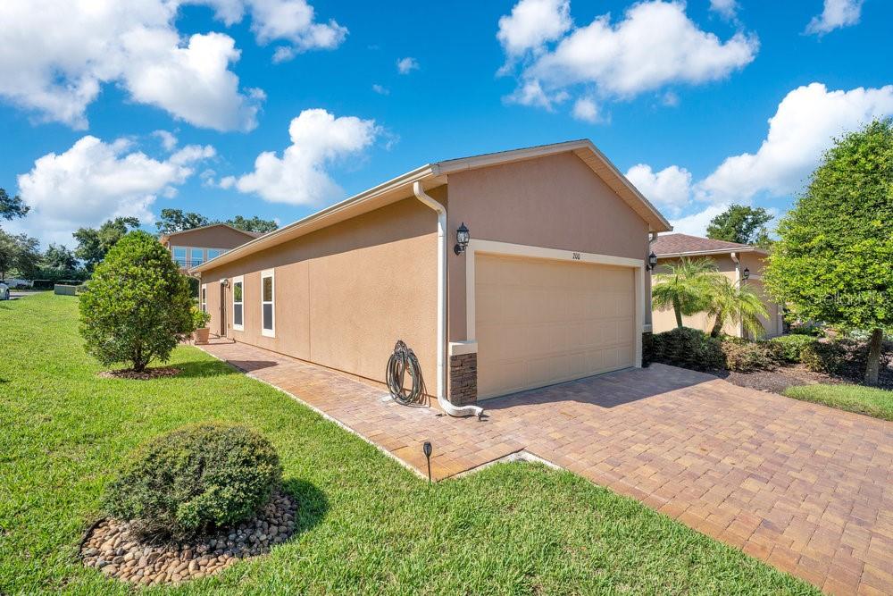 Welcome to your move in ready Deland home. This coroner unit has double panel windows through out the home, tinted windows (#3) on the south side, upgraded garage flooring with extra led lighting, overhead storage racks, along with a work bench and wall cabinets, water filtration system, new light fixtures, fans, and faucets in kitchen and master bathroom. Planation shutters on ALL window, added extra paver walkway to enclosed back patio area, roof over entire barbeque area, titled porch with roll up shading, and retractable front door screen with front door electronic lock and door handle. Come and tour your home today!