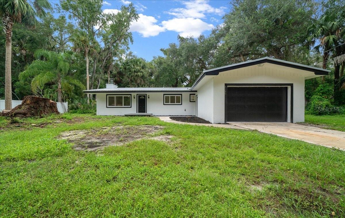 This stunning 3-bedroom, 2-bathroom home on .54 acres (no HOA) has undergone complete transformation. At 2,042 sq ft, it perfectly blends modern updates with country living. Every major system updated in 2025: new electrical, plumbing, and HVAC. Quality metal roof just 3 years old. New windows enhance efficiency and curb appeal. Interior features new flooring throughout, fresh paint, updated kitchen with new cabinets and Stainless-steel appliances. This meticulous renovation means new owners simply move in and enjoy. Exceptional parking includes 2-car garage plus RV carport. Spacious lot provides privacy while maintaining area access. Rare opportunity to own a completely updated home where every major component is brand new. No surprises, no deferred maintenance. Don't miss this property combining modern convenience with country freedom.