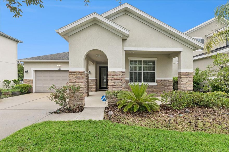 Welcome home to this beautifully maintained 3-bedroom, 2-bathroom residence located in the desirable Grande Champion community. From the moment you arrive, you’ll appreciate the exceptional curb appeal featuring lush landscaping, stone exterior accents, and a welcoming covered entry. Inside, an inviting foyer opens to a spacious and functional open-concept floor plan designed for comfortable living and effortless entertaining. The gourmet kitchen is equipped with stainless steel appliances, granite countertops, stylish backsplash, pantry, and a breakfast bar for casual dining. The adjoining living and dining areas provide an ideal space for gatherings, while tile flooring throughout the main living areas offers both style and easy maintenance. The spacious primary suite features a large walk-in closet and an ensuite bathroom complete with a shower and separate garden tub to soak away the stress from the day. Two additional bedrooms offer flexibility giving you the space you desire. An interior laundry room with built-in cabinetry adds convenience. Step outside to enjoy the screened-in patio with both covered and open areas, perfect for relaxing or entertaining year-round. Take advantage of the two car garage for parking or additional storage. The community features a sparkling pool and scenic walking trails with ponds and fountains. Conveniently located just minutes from Daytona Beach’s world-famous beaches, shopping, dining, and entertainment, this home offers the perfect combination of comfort, style, and location. Schedule your private showing today.