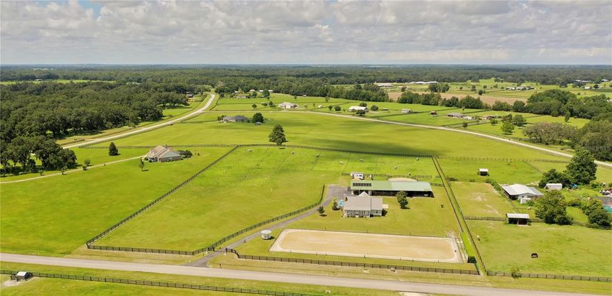 BRING OFFERS! Some equipment and furnishings could remain. Welcome to the Ocala, FL area where you can enjoy the World Equestrian Center just 20 minutes away! HITS is just 10 minutes away! Outstanding equestrian property situated in the sought-after Winding Oaks Estates community. Currently operating as a dressage training facility. Set on 6.33 beautifully maintained acres. Featuring 30 lush paddocks measuring 70'x70' and a spacious pasture. The barn is fully equipped with 10 stalls, each with an automatic watering system and a recent addition that houses a spacious tack room and 70'x35'x10' equipment storage, ideal for horse trailers, RVs or farm equipment. There's also a 1-bedroom apartment, approximately 490 sq ft within the barn. perfect for staff, guests or an income producing rental. Train like the pros in the regulation Olympic-sized dressage ring (20'x60') with a watering system, drainage system and full-length mirrors on one end.  The arena is complemented by a scenic gazebo viewing area overlooking the ring. The main residence offers 3 bedrooms and 3 full bathrooms in an open-concept layout. Features include a cozy wood-burning fireplace, fresh interior paint (2019), new LG kitchen appliances (2023), new roof (2024), updated kitchen cabinets (2023),  whole-house  plumbing replaced (2023), upgraded bedrooms (2022), 2nd guest room with a wall bed offers versatility as an office/den or a bedroom, new modern flooring, tile and vinyl plank (2020), high sheen epoxy garage floor (2025). New A/C (2023). The asphalt driveway was added in 2019. A beautiful pool provides the perfect spot for entertaining or unwinding after a long day at the barn. Solar heated.
This turnkey horse farm is ideal for trainers, hobbyists, or anyone seeking a peaceful country lifestyle. Conveniently located just 10 minutes from HITS and 20 minutes from the World Equestrian Center.
Call to schedule your private showing!