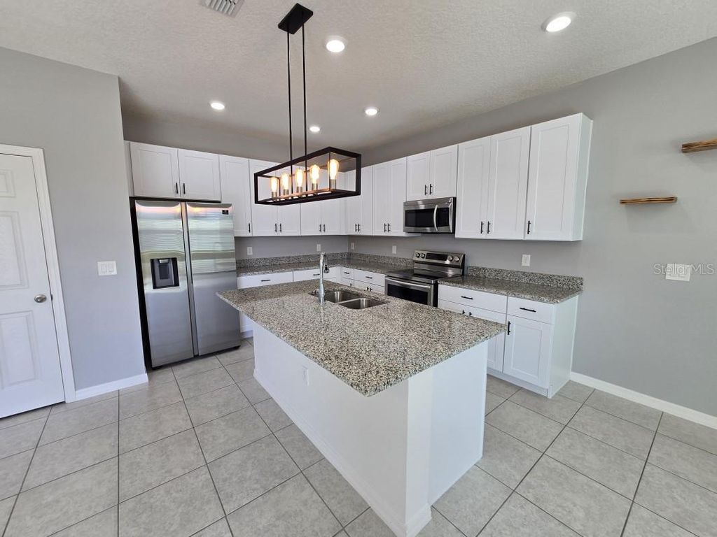 Photo of 231 Tarpon Bay Boulevard, Haines City, FL 33844 (MLS # A4667599)