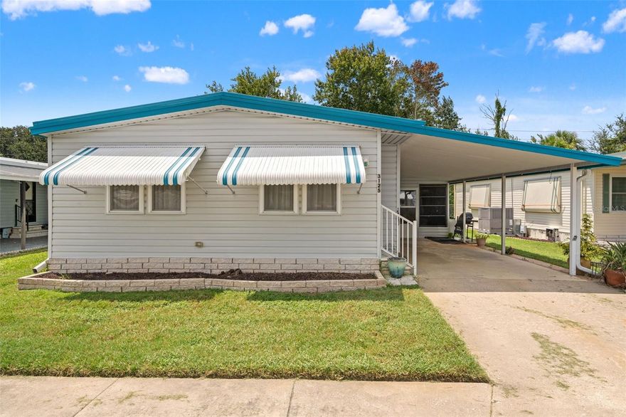 Stunning lakefront views at an attractive price! Welcome to 3125 Birkdale Drive, a perfectly cozy home for living the retirement or snow bird lifestyle! This home features 2 bedrooms and 2 bathrooms, with plenty of living space! As you pull up you'll be greeted by a large carport, with plenty of room to park your cars! Not only that, walk through your screened in lanai that can be used as a mud room, into a large storage shed with plenty of shelving! Let's step inside, your living room is nice and open with vaulted ceilings and enough natural light and windows that you'll never want to keep your lights on during the day! Towards the kitchen you'll notice a comfortable dining room area right off the kitchen, perfect for serving food and easy access for guests! Your two bedrooms are located in the back of the home, with your primary bedroom featuring stunning views of the backyard, as well as the primary bathroom. Stepping outside, you'll see your screened in lanai with a view of trees, and not far at all from lakes to enjoy beautiful waterfront views on a sunny day. With benches at every lake, this community is perfect for relaxing and living up the Florida lifestyle! This home has a low monthly HOA of only $143, but so many amenities come with it, including a heated pool, lawn maintenance, trash pick up, clubhouse, shuffleboard courts, and ground maintenance! If you are looking to live the Florida lifestyle at an amazing price, call today to make this one yours! You won't want to miss it!