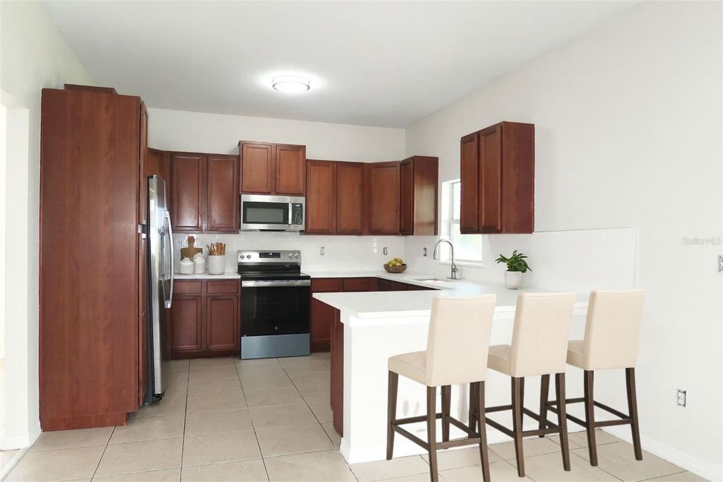 Photo of 556 19th Street NW, Ruskin, FL 33570 (MLS # TB8418819)