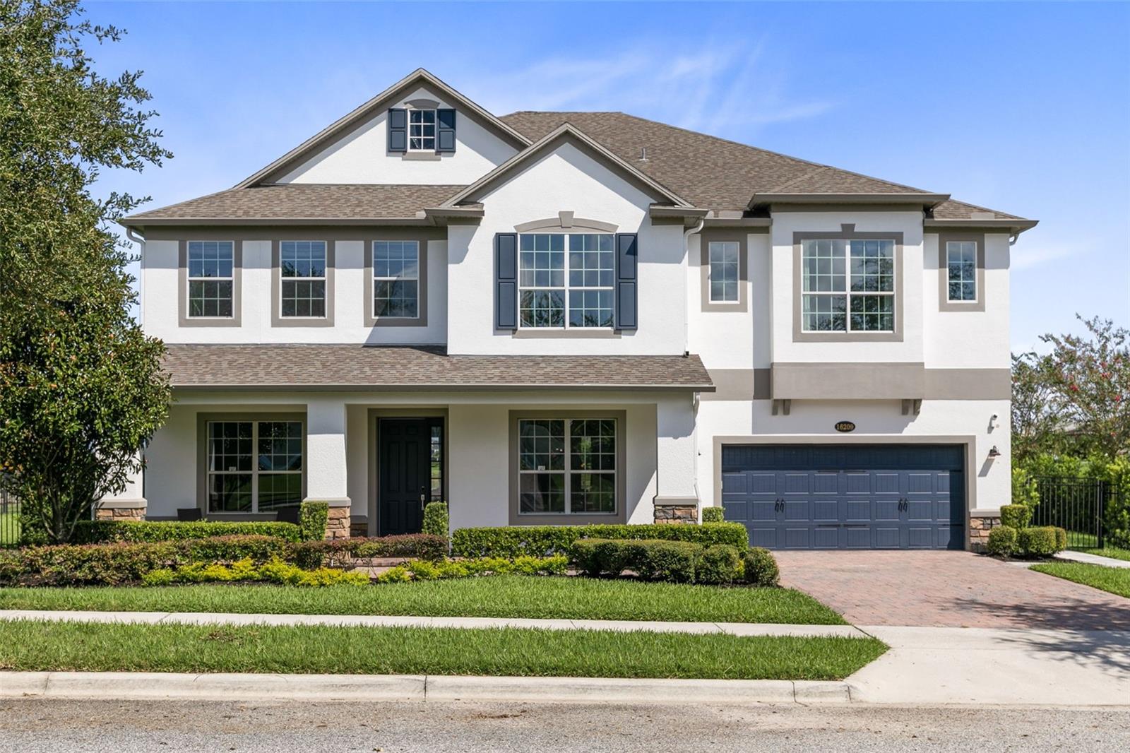 Welcome to this stunning lake front home in the sought-after, gated community of Hickory Hammock. The covered dock has been extended for fishing and features an electric boat lift that is set for one boat and 2 jet skis. The salt water infinity pool is a gorgeous oasis with a sun shelf, large spa and seating around a gas fire pit. There is a separate lower sun deck and the covered patio areas offers a full outdoor kitchen complete with grill, keg cooler, refrigerator and sink! Inside you will find 5 bedrooms, 4 full baths, a half bath, along with an office/den, massive upstairs loft with a full wet bar and a fully equipped theater room! No expense was spared while renovating this gorgeous home. The community itself offers resort level amenities including a pool, fitness center, tennis courts, playground, and fishing pier!