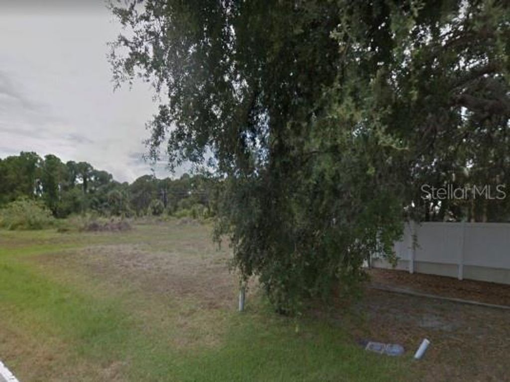 Photo of 249 Boundary Boulevard, Rotonda West, FL 33947 (MLS # O6383256)