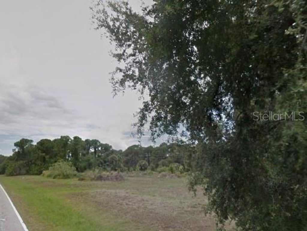 Photo of 249 Boundary Boulevard, Rotonda West, FL 33947 (MLS # O6383256)