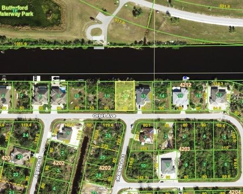 Photo of 13994 Orbit Ave, Port Charlotte, FL 33981 (MLS # C7524623)