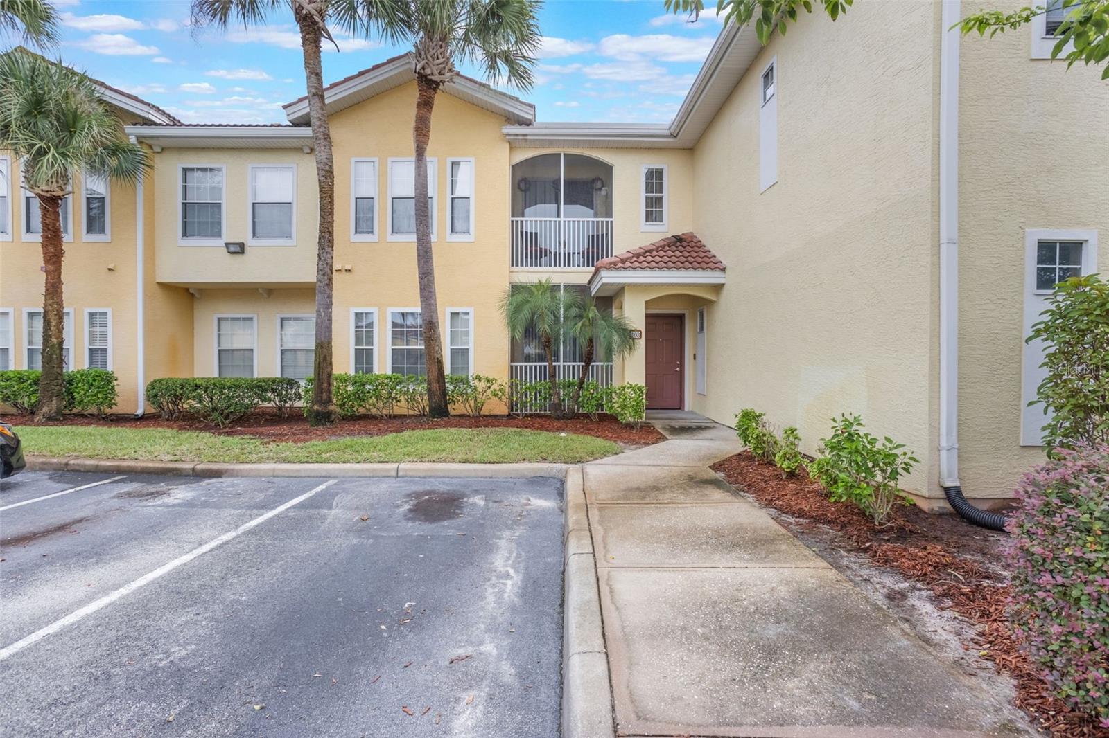 Welcome to Villanova at Hunter’s Creek! This gated community offers resort-style amenities in one of Central Florida’s most desirable areas. Conveniently located near shops, dining, and major roadways including the SR 417, this residence is ideal for both owner-occupants and investors alike.
This well-maintained ground-floor corner unit features a bright, open floor plan with porcelain tile throughout—no carpet and no stairs. The kitchen is equipped with solid wood cabinetry, Corian countertops, and a breakfast bar. The washer and dryer are also included.
The spacious primary suite offers a walk-in closet, dual vanities, and a soaking tub, while the secondary bedroom enjoys abundant natural light, its own walk-in closet, and an adjacent full bath. Step outside to your front screened-in lanai, perfectly set against lush tropical landscaping. It is just perfect for enjoying your cup of coffee in the morning or tea in the evening!
The attached one-car garage—extra deep at 25 feet—has a private entrance directly into the condo for added convenience. Just steps away, you’ll find the community clubhouse, fitness center, and resort-style pool.
Hunter’s Creek consistently ranks among the best places to live in Central Florida, known for its excellent schools, community events, and unbeatable location. Schedule your showing today and experience the Villanova lifestyle for yourself!
