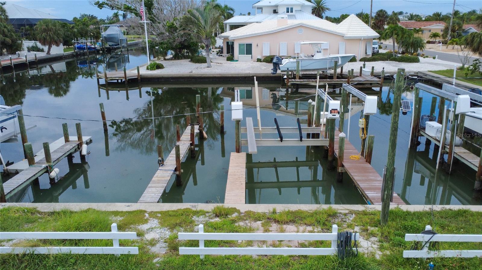 Is your boat looking for a new crib? Located in a central island location in the heart of Key Royale this over sized deeded boat slip with dock and 10,000 lb lift offers all the waterfront convenience without the waterfront price tag. With no bridge obstructions and direct access to Tampa Bay, it’s an ideal launch point for avid boaters seeking both convenience and location.
