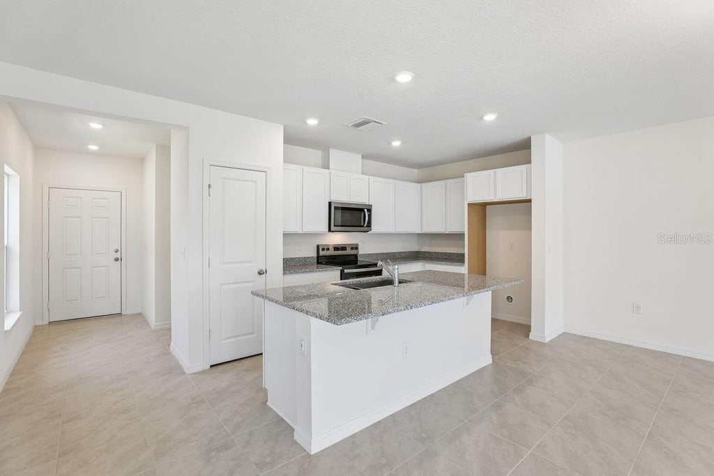 Photo of 520 Pine Ridge Court, Lake Wales, FL 33859 (MLS # O6443208)