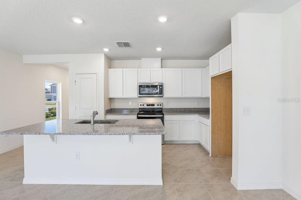 Photo of 520 Pine Ridge Court, Lake Wales, FL 33859 (MLS # O6443208)
