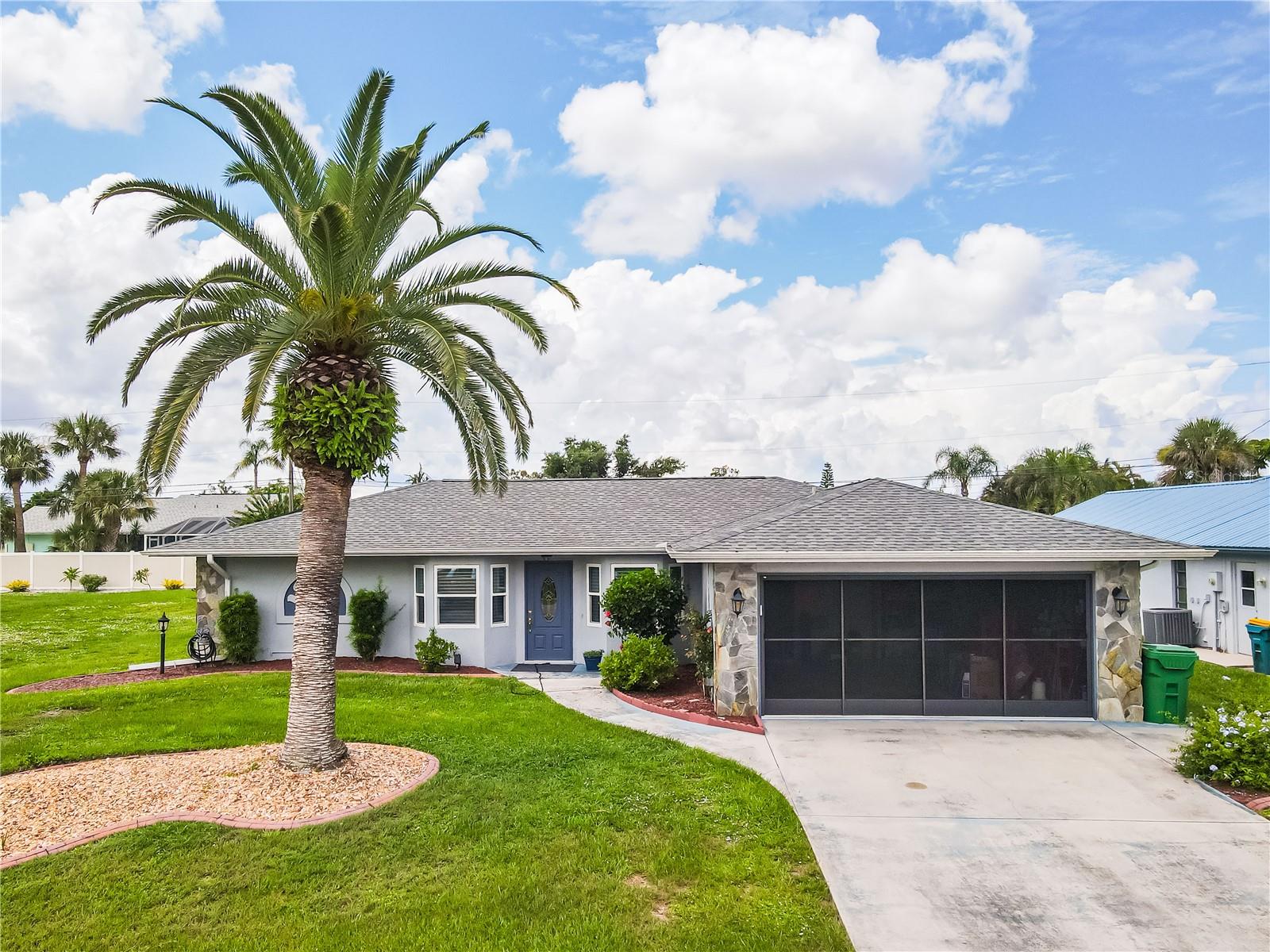 CHARMING 2 Bedroom, 2 Bathroom, 2 Car Garage, Pool home with a Florida room, located in Englewood East. NO HOA FEES & NO FLOOD REQUIRED! CLICK ON THE VIRTUAL TOUR LINK 1 FOR THE VIDEO AND VIRTUAL LINK 2 FOR THE 3D TOUR. Featuring a bright & airy floor plan, tile flooring throughout, vaulted ceilings, skylights, and MUCH MORE! Spend quality time with friends and family in the living room with a glass slider to the Florida room. The kitchen offers all appliances, solid surface counter tops, a service window to the Florida room, and an off-kitchen dining room. The spacious master bedroom has a glass slider to the Florida room, a walk-in closet, and a private en-suite bathroom with a single sink vanity and soaking tub. The guest bedroom is on a split floor plan, providing plenty of privacy with a glass slider to the Florida room, a built-in closet, and a nearby guest bathroom with a walk-in shower. The versatile Florida room offers a flexible living space that can easily adapt to your needs—whether you’re looking for a home office, media room, reading nook, or a relaxed lounge area, it’s ready to fit your lifestyle. The large lanai is perfect for hosting summer barbeques, sipping your morning coffee, or unwinding with your favorite evening beverage. Enjoy your own private heated pool, complete with a built-in jacuzzi for ultimate relaxation and a solar cover to help maintain warmth and reduce energy costs. 2021 ROOF - SEPTIC PUMPED 7/2025 - HURRICANE PROTECTION - SCREENED GARAGE DOOR. Conveniently located near shopping, fine & casual dining spots, LIVE entertainment, biking, and boating. JUST A SHORT CAR RIDE to the Gulf Beaches of Englewood, Boca Grande, or Manasota Key, to name a few, where you will find white sand between your toes, boating, and world-class fishing. Schedule your showing TODAY!