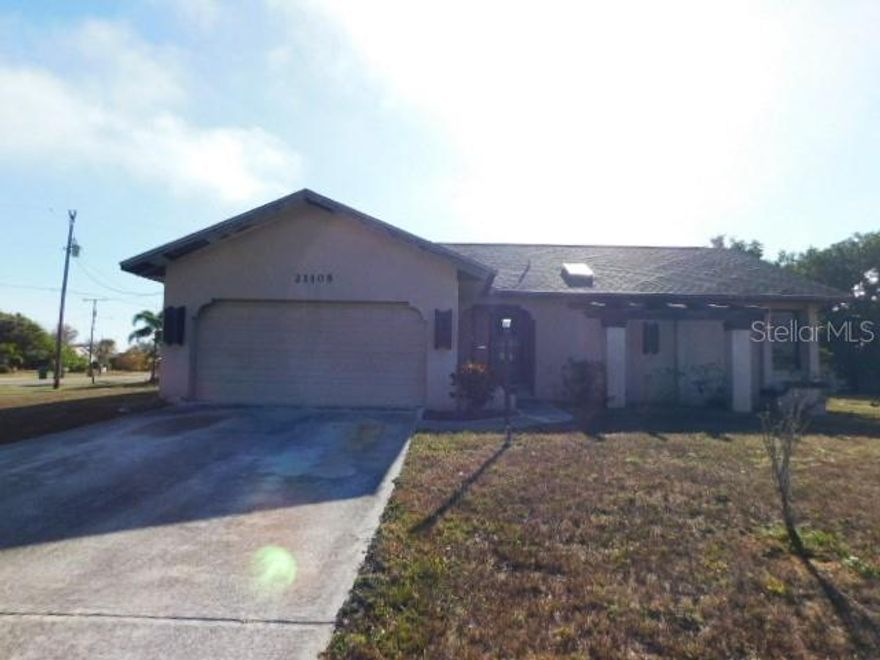 3/2 located on a large corner lot. Split bedroom plan, spacious living room features high ceilings with sliding glass door leading to porch area. With a little TLC this home would be great again. Located approximately 1 mile to the Port Charlotte Beach Park. Buyer is advised to have complete and thorough inspections done and to verify all information. Seller/Agents have no knowledge of property conditions. Being Sold As-Is.