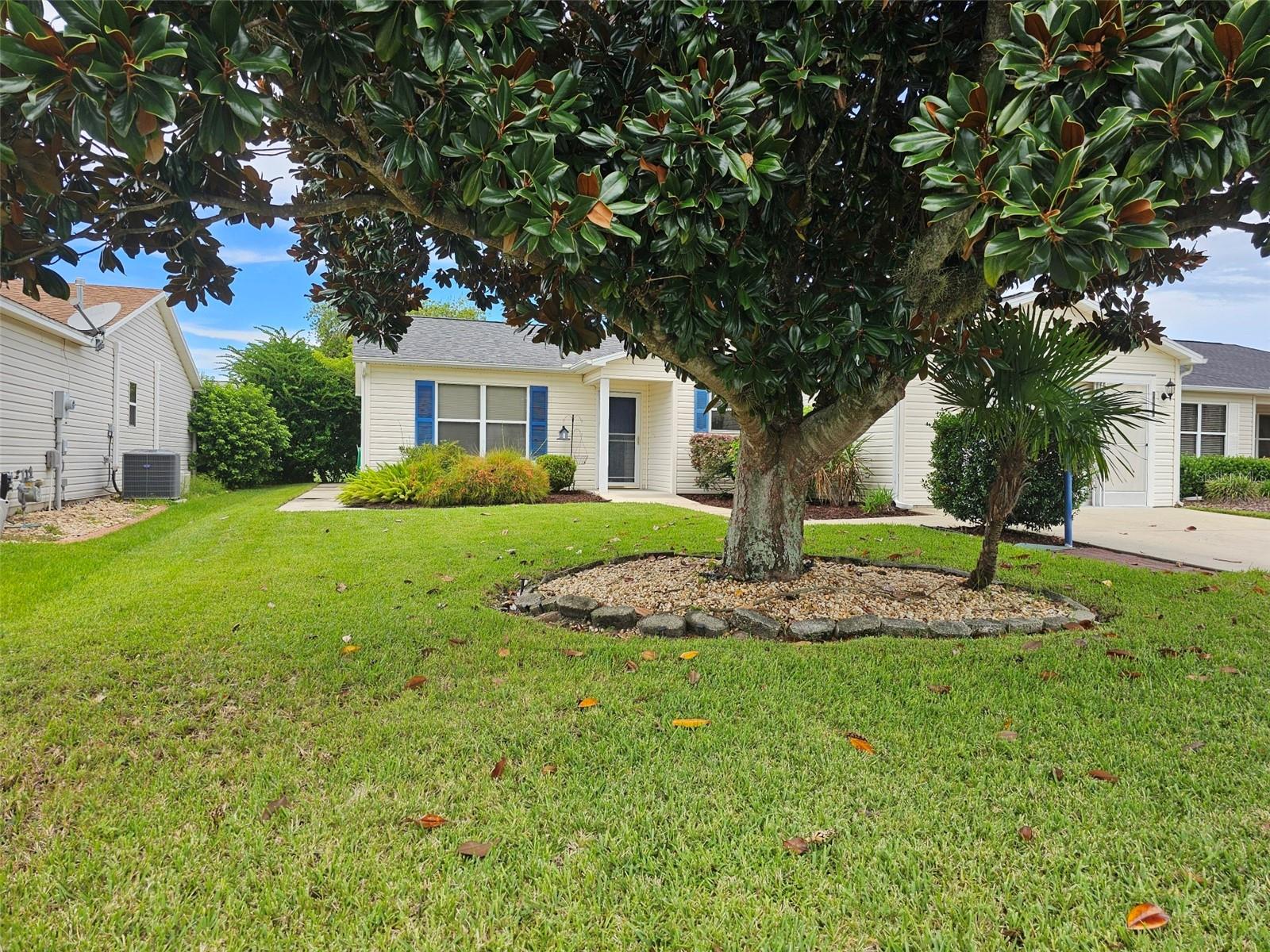 Experience comfort and convenience in this beautiful ADA-compliant 3-bedroom residence, featuring a spacious enclosed Florida room that’s both cooled and inviting. Inside, enjoy gas heating and a cook stove, along with a north-south orientation that maximizes natural light. The primary suite includes a generous walk-in closet and easily accommodates a king-sized bed, with an oversized bathroom and shower for added luxury.
The open floor plan creates a welcoming environment, ideal for entertaining, with the clean and well-cared-for living and dining areas perfectly suited for gatherings. The kitchen is equipped with modern stainless steel appliances and a solar tube for abundant daylight. A split floor plan offers privacy, with the second bedroom at the front and a third bedroom at the back, both conveniently located near the guest bath.
Immediate possession is available, and the home boasts no carpeting for easy maintenance. The charming 3-2 model includes a roomy 1.5-car garage, attic stairs for extra storage, French doors open to a private backyard with beautiful landscaping, providing natural privacy for two distinct lanai area
Located in the tranquil Village of Summerhill, you’ll be less than half a mile from the Summerhill Recreation and Mail Center, which features a pool, bocce, and shuffleboard. Enjoy easy golf cart access to Lake Sumter Landing and Spanish Springs Town Squares, and proximity to both Arnold Palmer and Glenview Golf and Country Clubs. Nearby amenities include Wedgewood Shopping Plaza, Publix, restaurants, Laurel Manor Library, medical facilities, and more.
Recent updates include a new HVAC system (2024), a roof Aug 2025, and a 2018 hot water tank.
Don’t let this opportunity become the one that got away—schedule a visit and experience all this exceptional home has!