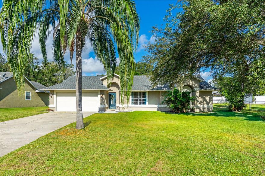 This well-maintained home features a screened-in pool and back porch, perfect for relaxing or entertaining. Enjoy a large backyard with mature trees and a hammock area, creating a peaceful outdoor retreat. Inside, the updated kitchen offers stainless steel appliances, quartz countertops, and a large window overlooking the pool and backyard. The home includes two living areas, a split floor plan, a 2-car garage, and a long driveway for extra parking. Major updates include a new roof (2022). Conveniently located just 5 minutes from Publix, shopping, dining, and more. This home blends comfort, style, and a prime location!