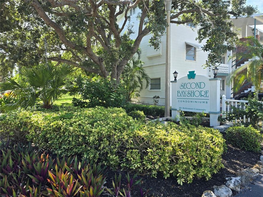 Step into this fully furnished 1-bedroom, 1-bathroom ground-floor condo nestled in the vibrant, welcoming Second Bayshore 55+ Community in beautiful Bradenton, Florida. This charming unit is move-in ready and offers upgraded tile flooring throughout, tasteful furnishings, and a sunroom converted to interior living space, providing extra comfort and functionality. Enjoy a light and bright kitchen with classic cabinetry and stylish finishes, perfect for cooking or entertaining. The spacious bedroom features serene views, while the updated bathroom includes a walk-in shower with grab bars for added accessibility. Bayshore is known for its friendly neighbors and array of amenities including a heated community pool, clubhouse, shuffleboard courts, and regular social events. Low condo fees ($245/month) cover exterior maintenance, grounds-keeping, pest control, and more—making this condo not only affordable but hassle-free. Located just a short walk from the pool and minutes from shopping, dining, golf, and the fine sandy beaches of the Gulf Coast, this is the Florida lifestyle you've been waiting for.