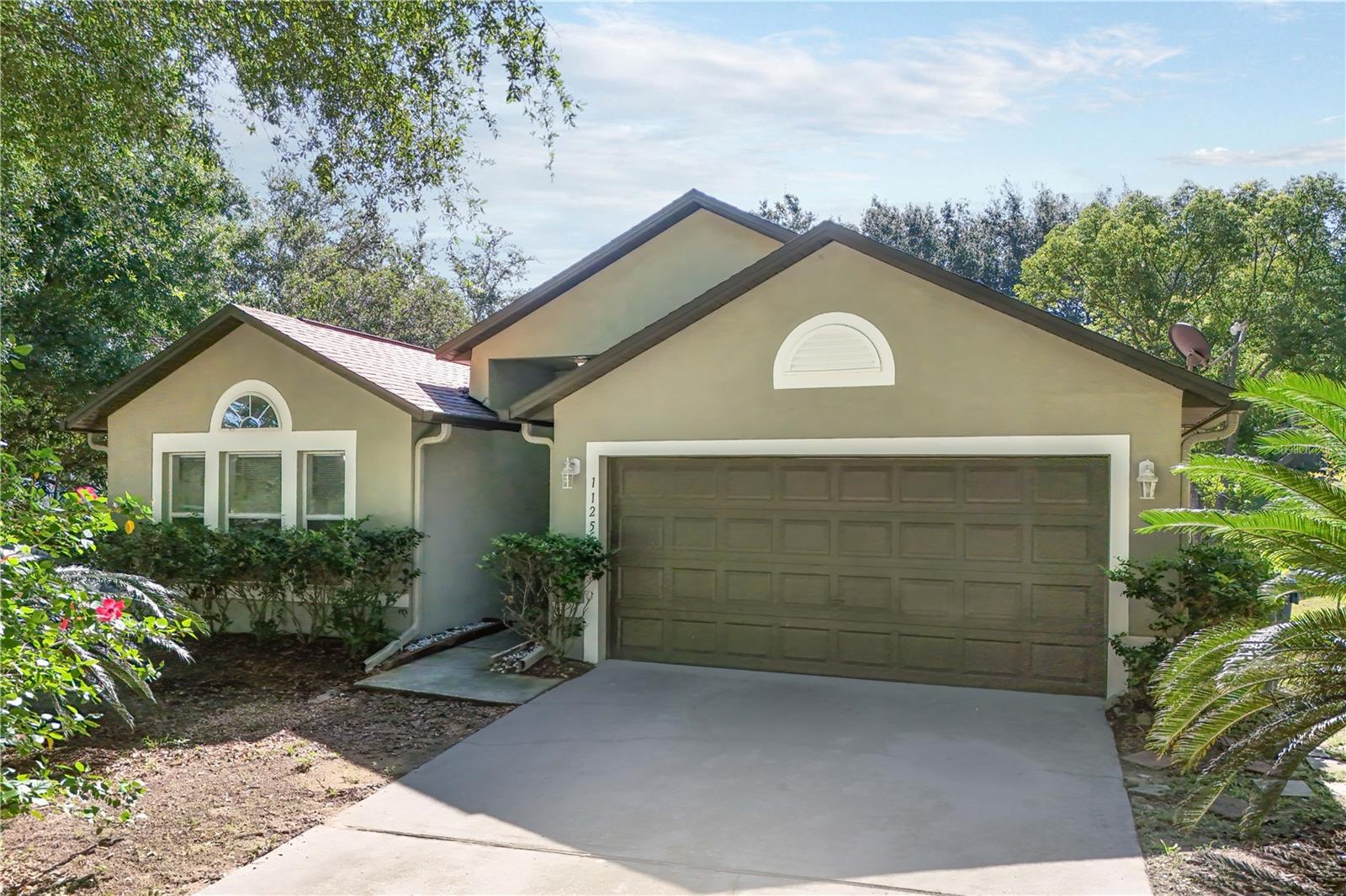 Welcome to Minneola Oak Valley! This neighborhood is ideally located close to Hwy 27, Hwy 19, and the Turnpike! This beautiful home is on an oversized corner lot with mature oaks and there's plenty of room in this spacious 4 bedroom, 2 bath home. The entire home's flooring was replaced in 2023 with porcelain tile flooring, NO carpet! The roof was replaced in 2019, HVAC system in 2021, range and refrigerator in June 2025.The common areas are open concept which make for a great entertaining! The living/dining combo leads to the kitchen which features an eat-in area. On the other side of the kitchen is a family room that circles back around to main living room. Both bathrooms have been remodeled with a beautiful modern look. Outside, you can enjoy a large backyard with plenty of room for a pool, playset, outdoor kitchen, or garden. There's a lot of possibilities with this home. Oak Valley is minutes from major highways, medical facilities, shopping, dining, and entertainment and the neighborhood has a playground. Dependent on the offer, SELLER WILL PROVIDE UP TO $5,000 TOWARDS THE BUYER"S CLOSING COSTS!