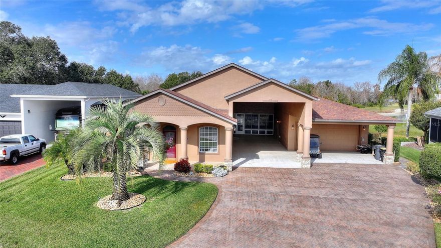 Beautiful 2 bedroom/2-bathroom home located in Mt. Olive Shores North, a 55+ RV community. This well-maintained home offers numerous updates including a new roof in 2022, new hot water heater in 2025, new AC-Heating unit, new irrigation pump for the well, plus a new dishwasher and washing machine. In 2014, the lanai was enclosed and equipped with heating and air, creating comfortable additional living space with views of the outside patio, fountain and the retention pond with lots of wildlife. The property also offers a two-car garage, carport and an RV port measuring 55x16, along with plenty of additional parking for all of your needs. Come see this lovely home and enjoy the RV lifestyle.