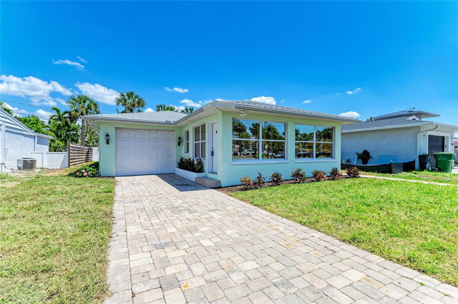 Welcome to your slice of paradise on St Armands Circle, moments from the sugar sands of Lido Beach! This exquisitely renovated and stylish coastal living home offers refined island living with every modern luxury. Impeccably designed with fresh and modern aesthetic, this home boasts high-end finishes and indoor-outdoor living spaces Bright, open spaces flow seamlessly to outdoor areas perfect for entertaining or relaxing after a beach day. Enjoy designer touches, custom closets, lush landscaping, a new roof, new AC and walkable access to world-class dining, boutique shopping and sunset strolls on the beach. Whether you’re soaking up the sun on the beach or exploring vibrant local shops and restaurants, this is the ultimate island retreat and has all the charm of island life with the convenience of Sarasota’s best amenities at your doorstep! Convenient to beaches, shopping and the Sarasota/Bradenton International Airport, this fully renovated home is a rare find. Luxurious updates and an unbeatable location make this property ideal for year-round living, a seasonal escape or an exceptional investment.