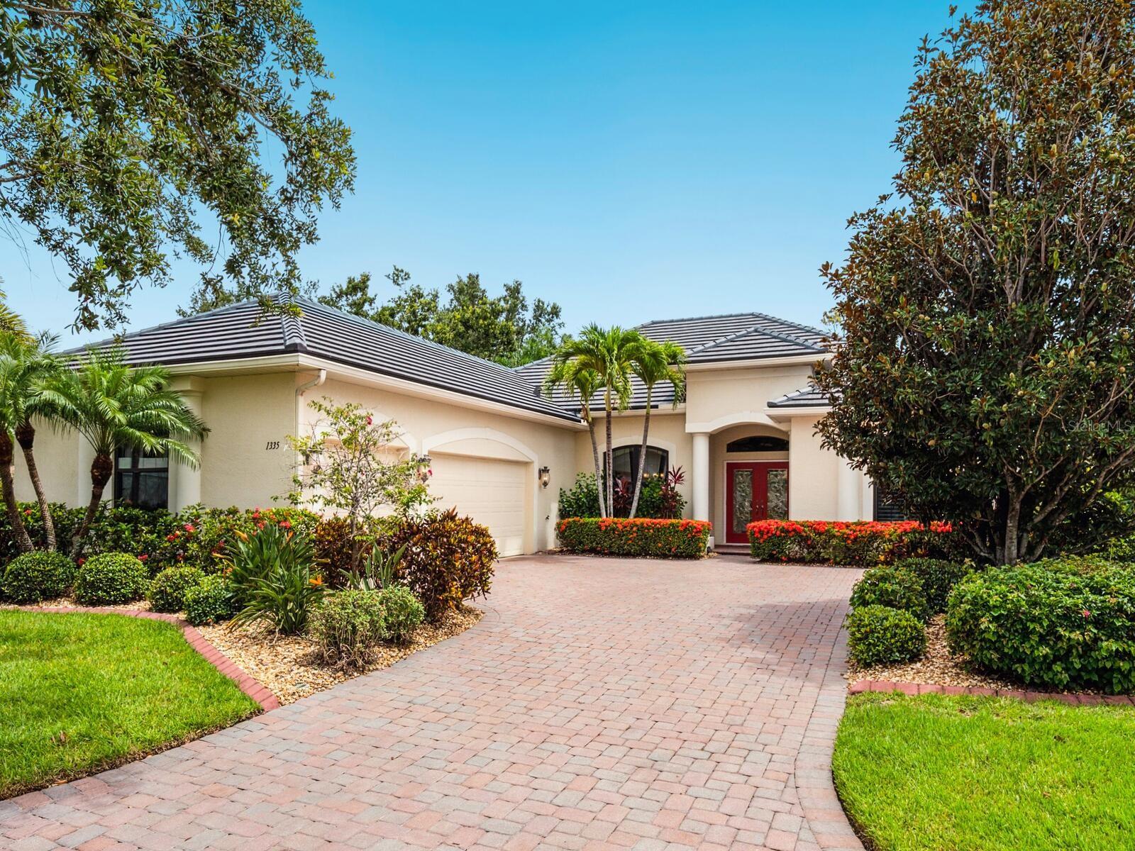 Located on a quiet cut-de-sac in the highly desirable Pelican Pointe Golf & Country Club, Venice’s premier gated lifestyle community, this Siesta II floor plan home offers spacious, open-concept living with 4 BEDROOMS, OVERSIZED 3-CAR GARAGE, and a NEW ROOF installed in MAY 2025. Enjoy peaceful LAKE VIEWS from your SALT-FILTERED POOL AND SPA, finished with high-quality PebbleTec and surrounded by a screened lanai with easy-to-clean Pro-Tile stamped concrete sun deck. High ceilings with crown molding, impact-strength beveled-glass French front door entryway, elegant foyer listello inlay, and lighted niches add architectural charm. The open kitchen features abundant solid-wood cabinets and granite countertops, built-in desk area, and a bay window dinette, perfect for morning coffee with tranquil views. This home also features WHOLE-HOUSE HURRICANE PROTECTION with front and side PGT impact windows, accordion shutters, and motorized storm shield for the lanai. Additional features include Bermuda shutters, plantation shutters, central vacuum system, and durable epoxy floor coating in the garage. The split-bedroom layout provides privacy for guests or a home office. The largest bedroom has sliding doors opening to the pool area with a fabulous view. A pocket door also creates a spacious 2-bedroom guest suite by including the guest bathroom and 3rd bedroom. The primary suite offers a large walk-in closet and luxurious bath with dual vanities and sinks, soaking tub, walk-in shower, and private WC. Your social membership provides access to an active clubhouse with restaurant and bar, fitness room, tennis courts, pickleball, and heated lap pool, all surrounded by beautifully maintained grounds and natural preserves and a premier 27-hole championship golf course. HOA fees are modest and include lawn maintenance, cable, and internet, security, and management, creating more time for you to enjoy the things you love. The community is known for its welcoming atmosphere, active social calendar, and top-tier amenities, making it one of the most desirable places to live in Venice, Florida. Conveniently located just minutes from historic downtown Venice, sandy Gulf beaches, shopping, dining, and medical facilities, Pelican Pointe offers a rare blend of luxury and practicality.