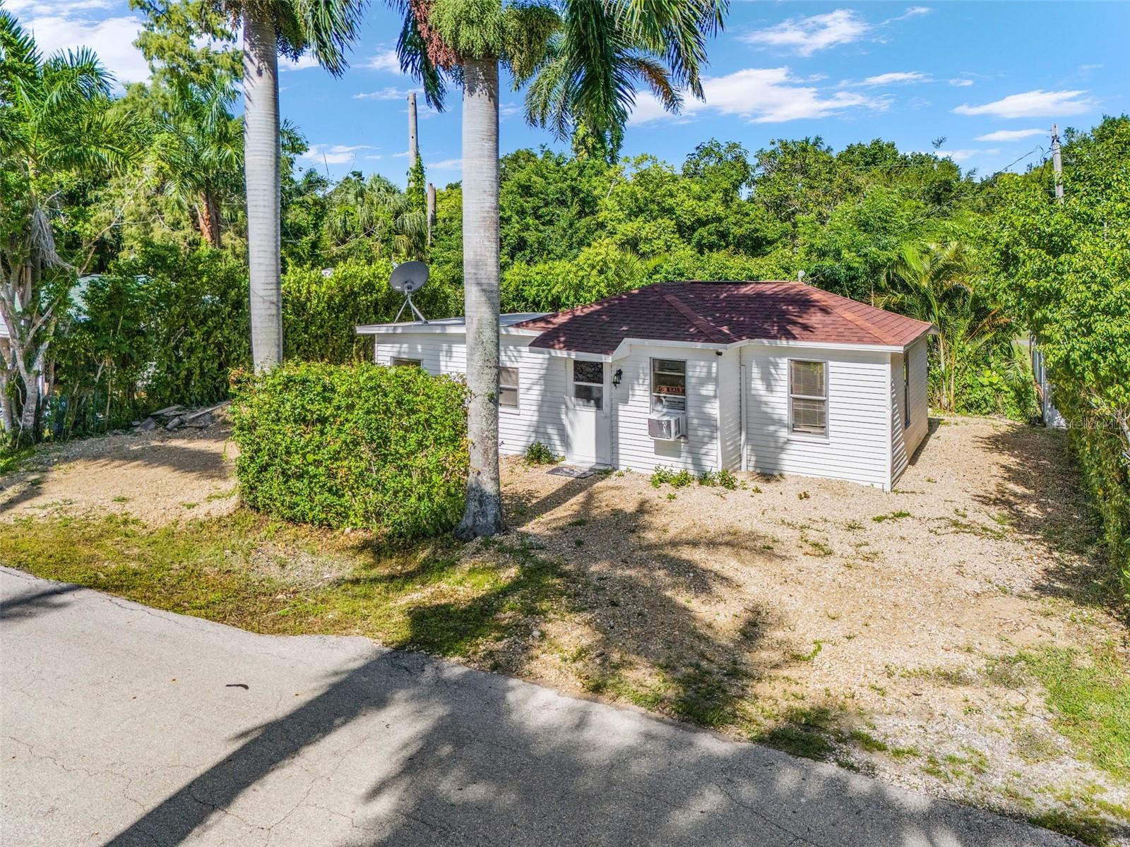 Updated and Move-in ready 2 bedroom, 2 bathroom home featuring a brand-new roof (2023), new concrete foundation with waterproofed walls, and tile flooring throughout. Conveniently located just minutes from downtown Fort Myers, close to shopping, restaurants, and entertainment. Situated in a quiet, charming neighborhood. Ideal for year-round living or investment. Put your personal touch into this home to make it yours