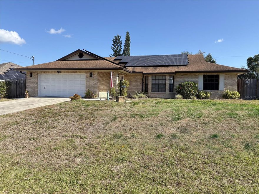 This Deltona single-story home offers an in-ground pool, enclosed patio, bay windows with natural lighting, kitchen granite countertops, stainless steel appliances, master bathroom dual sinks, and a two-car garage. Updates include fresh interior paint.