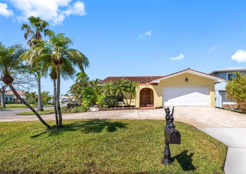 Photo of 562 Johns Pass Avenue, Madeira Beach, FL 33708 (MLS # TB8520269)