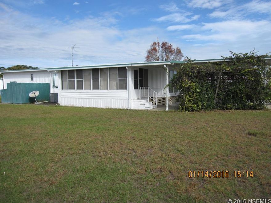 WHAT A GREAT PRICE! GORGEOUS AND MOVE-IN READY!THIS WELL MAINTAINED MANUFACTURED HOME FEATURES AN EAT-IN KITCHEN WITH BAY WINDOW AND LAMINATE WOOD FLOOR. SPACIOUS LIVING ROOM, GORGEOUS BATH WITH CHERRY CABINETS AND CEDAR CLOSET, INSIDE LAUNDRY AREA WITH STORAGE, RELAXING GLASS ENCLOSED FLORIDA ROOM, HUGE COVERED CARPORT AND ROOM FOR RV OR BOAT. 2 WELLS ( ONE FOR HOUSEHOLD USE AND ONE FOR IRRIGATION SYSTEM ), FULLY FENCED YARD, ALL CEMENT BLOCK SKIRTING SURROUNDS HOME. PERFECT FOR WEEKEND GETAWAY, SEASONAL, OR A PLACE TO CALL HOME.
