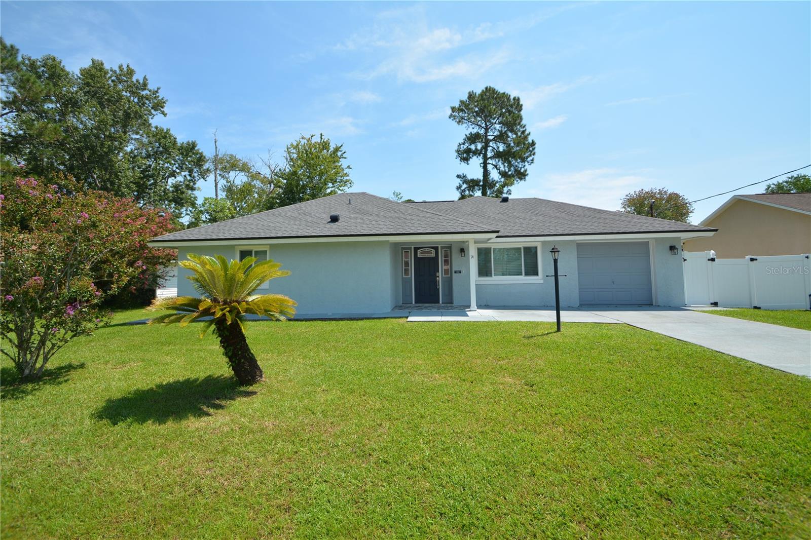 Savor the serene charm of coastal living at 14 Bolling Lane, Palm Coast, FL 32137, where comfort meets convenience in this delightful 3-bedroom, 2-bathroom home. Nestled in a tranquil neighborhood, this charming residence offers a generous 1,035 square feet of thoughtfully designed living space. Step inside to discover an inviting open floor plan that seamlessly connects the cozy living area with a well-appointed kitchen, perfect for hosting intimate gatherings or unwinding after a day at the beach. The three spacious bedrooms provide ample room for relaxation, while the two full bathrooms ensure comfort and privacy for all occupants. Natural light pours through the windows, illuminating the warm and welcoming interior, creating an atmosphere that feels like home from the moment you walk in. The property's prime location in Palm Coast offers easy access to beautiful beaches, lush parks, and a variety of local amenities, making it an ideal retreat for those seeking both adventure and tranquility. Whether you're enjoying a morning coffee on the porch or exploring the vibrant coastal community, this home promises a lifestyle of ease and enjoyment. Learn more about the benefits of deposit-free living here: See the Obligo brochure https://depositfree.myobligo.com/hubfs/Partner%20Resource%20Center%20(Obligo%20x%20Buildium)/Tenant%20Brochure.pdf