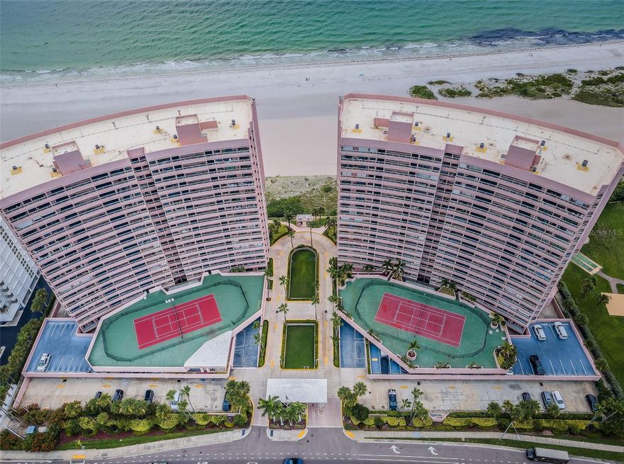 Presenting a rare opportunity to own the Crescent Beach Club II Luxury Sky Penthouse "A". The Ultimate crown jewel of Sand Key Beach with Gulf front grandeur featuring the panorama of the gulf and intracoastal regatta views from five balconies! Wow factor terraces from every room featuring sweeping aquamarine seascapes and balmy beach breezes, this coveted corner residence has breath taking views of the morning sunrises, tranquil sunsets and exciting Clearwater downtown. Terraces ideal for the avid sun worshipper with spectacular outdoor living and entertaining. Residence offers a fusion of French décor and Italian-inspired design of grand living space with modern crystal cascade chandelier, polished travertine floors, fireplace, spacious open floor plan with an abundance of natural light and water views from every room! Cucina features Frigidaire Professional Stainless Collection, dual ovens, custom cabinetry, bar height peninsula and more! Dining area with wet bar, scenic surround sweeping ebb and flow of Gulf Waters. Master suite features terrace access and bath retreat jetted tub, walk in shower and spectacular picture window Gulf views!  Hurricane Shutters for year-round protection. Enjoy direct access to the beach, heated oceanfront pool and spa, 4 BBQ grills, 2 sets of tennis/pickleball courts, indoor hot tub overlooking the beach, fitness center, and a billiards room. Crescent Beach Club offers resort-style living within a gated complex, 24-hour security, on-site management, and private level owners parking. Enjoy the convenience of walking to nearby restaurants, shops and boutiques.