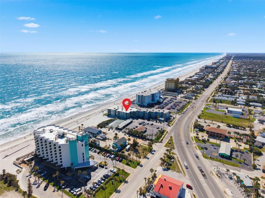 Welcome to your beachfront escape in the highly sought-after Ocean Reef Villas in New Smyrna Beach! This beautifully updated 1-bedroom, 1-bath condo offers over 800 square feet of coastal living with direct beachfront access and incredible income potential.  Step inside to find a thoughtfully updated kitchen, a spacious living area, and a luxurious pull-out couch—perfect for accommodating guests. The unit also features the convenience of an in-unit washer/dryer combo, making extended stays and rentals effortless. Ocean Reef Villas is one of the few buildings in New Smyrna Beach that still permits short-term rentals, making this an exceptional opportunity for investors or those seeking a vacation home that can generate income. Even better, the community offers an on-site manager who can handle bookings and day-to-day rental operations for a truly hands-off ownership experience. Enjoy resort-style amenities including a stunning beachfront pool that captures all-day sun, along with direct access to the sand and surf just steps from your door.  Whether you’re looking for a personal coastal retreat or a high-performing rental property, this condo checks all the boxes. Schedule your private showing today and start living the beach life!