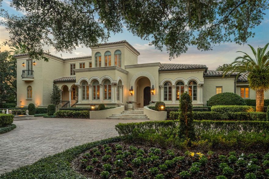 Located within the gates of the Isleworth Golf and Country Club community, this 7,821 square foot estate presents you with breathtaking views of the 8th fairway and glistening Lake Bessie.  The interior boasts features such as Venetian plaster walls, custom woodwork accents, marble & travertine floors, and vaulted ceilings. 
The living spaces have been thoughtfully designed with built-ins that provide both functionality and style. In the central gourmet kitchen, you’ll be equipped with top-of-the-line Subzero appliances, along with a bar and butler station conveniently located nearby.  The spacious gym offers the perfect opportunity to stay fit and healthy within the confines of your own estate.  With 5 bedrooms, 5 full bathrooms, and 2 half bathrooms, this estate offers a level of comfort and grandeur with a sprawling bonus / game room upstairs.
Outside, you'll find a resort-like oasis complete with a sparkling pool and soothing hot tubs, alongside an outdoor kitchen and grill.  The expansive 7+ car garage, a rare find, ensures that your prized automobile collection is readily available.