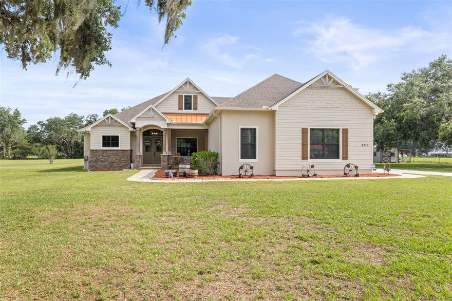 A Hidden Gem Between Lakeland & Tampa with a lot of space to garage 8 cars or use the additional 1500sf building for workshop, storage or more.  Meticulously maintained custom home on *OVER TWO ACRES* surrounded by farmland.  * NO HOA or CDD fees! *  This property offers easy access to the city while providing the privacy and serenity of rural living on a dead-end street.  The attached 3-car garage featuring 15’ ceilings, a 220 outlet, a work nook with a utility sink, and expansive attic storage. *The detached 28'x50' garage has 18’ ceilings, ROLL-UP DOORS  and WALL-MOUNTED DOOR OPENERS, for smooth access for vehicles stacked on lifts. *Seller can remove lifts * to transform it into open space so you have a blank canvas to use how you need.  Now about this custom home: This home has experienced ***NO STORM DAMAGE*** from previous storms. Has *WHOLE-HOUSE GENERATOR*, plus energy-efficient upgrades like a PROPANE TANK  powering a TANKLESS WATER HEATER,  FIREPLACE  and LARGE OUTDOOR KITCHEN. Outdoor living is elevated with an *EXPANSIVE 52x19 SCREENED LANAI with PAVERS. ** ENERGY EFFICIENCY includes FOAM SPRAY INSULATION inside the block and ICYNENE INSULATION in the ceilings—BOTH main home and detached garage. These enhancements provide superior temperature control and lower energy costs.  Now for in the inside details: Experience modern amenities with rustic charm. WOOD PLANK TILE flooring throughout the main living area, plush carpet in bedrooms. CUSTOM CABINETS with SOFT-CLOSE doors and drawers, GRANITE countertops. The WALK-IN PANTRY features a SENSOR LIGHT, ensuring convenience as you step in. Smooth cooktop with HOOD VENTED to OUTSIDE, built-in microwave and CONVECTION OVEN.  *TALL  8’ DOORS and high ceilings enhance the home's spacious feel, with tray ceiling designs and CEDAR-COVERED BEAMS in the kitchen.  **SEAMLESS BLUETOOH SPEAKERS are integrated into recessed lighting in both the main living area and lanai. The primary suite featuring French doors with BUILT-IN MINI BLIND in GLASS DOOR leading to the lanai. *DUAL WALK-IN CLOSETS and DUAL VANITIES.  The spa-inspired WALK-THROUGH SHOWER with MULTIPLE SHOWER HEADS, while the BEAR-CLAW foot SOAKING TUB invites relaxation. Additional Storage & Outdoor Convenience Beyond the garages, the property includes a 12x24 shed with electric.  A COVERED LEAN-TO provides the perfect spot to store kayaks, outdoor gear.  Ample space on the property allows for RV parking and adding a pool.  Too many details to list here, come see what makes this country haven so special.
