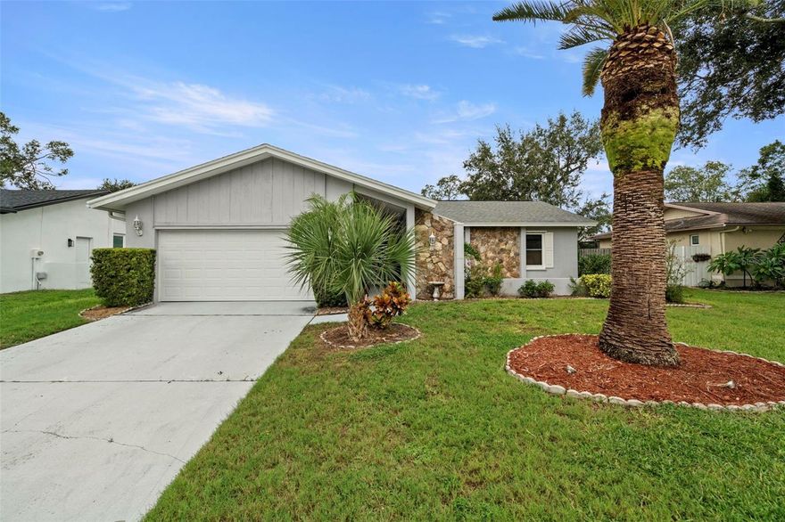 From the moment you walk through the front door, your view of the pool is so inviting you want to dive right in! Welcome to this charming three-bedroom, two-bath single-family home nestled in the desirable community of Safety Harbor, Florida. This inviting residence boasts a newer roof (2020), ensuring durability and peace of mind for years to come. As you enter, you'll appreciate the spacious layout that seamlessly connects the living areas, perfect for both relaxation and entertaining. A huge wood-burning fireplace and vaulted ceilings make for great evenings with friends. The home features efficient air conditioning (2016), keeping you comfortable during the warm Florida months, along with a newly installed (2024) water heater for your convenience.

The remodeled kitchen features beautiful cabinetry, granite countertops, and stainless steel appliances—ideal for the home chef. A new garage door and opener add to your safety and security, along with storm shutters and newer windows.

Retreat to the spacious and elegant primary bedroom, your own private haven featuring crown molding, generous walk-in closet,  and a luxurious en suite bathroom. Whether you're getting ready for the day or winding down, this serene space offers comfort, style, and plenty of room to relax.

Step outside to discover your very own private oasis, highlighted by a sparkling pool that invites you to unwind and enjoy the sunshine. The surrounding space is ideal for hosting summer barbecues or simply lounging with family and friends. Additionally, the attached garage provides convenient parking and ample storage space, making everyday living a breeze.

Location is key, and this home is perfectly situated just half a mile from the picturesque Philippe Park, offering beautiful walking trails, picnic areas, and stunning waterfront views of Tampa Bay. With its blend of comfort, convenience, and outdoor leisure opportunities, this property is an exceptional find. Don’t miss your chance to experience the best of Safety Harbor living—schedule a showing today and envision your life in this lovely home!