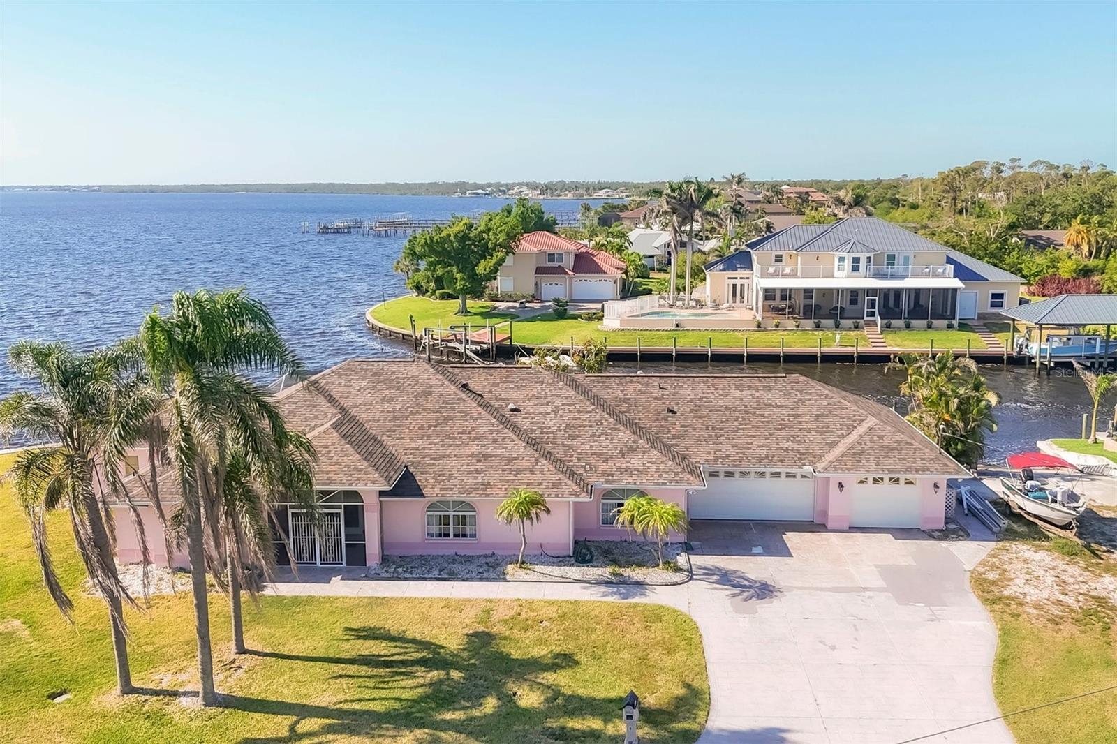 WATERFRONT PARADISE WITH PRIVATE BOAT RAMP!
Welcome to your dream waterfront retreat in Port Charlotte, where sunshine and serenity await! This spacious 2,615 square foot home offers the perfect blend of comfort and coastal living with 3 bedrooms and 2 bathrooms.
What sets this property apart? You'll own the ONLY private boat ramp in the community! Boating enthusiasts will appreciate the seawall and TWO boat lifts—a standard one for your smaller vessel and a robust 12,000-pound capacity lift for your larger watercraft with access to Gulf of Mexico. Located on a premium lot near a tip lot on Myakka River/Charlotte Harbor, you'll enjoy breathtaking water views that change with each sunset.
The home's generous layout provides ample space for family living and entertaining. The primary bedroom offers a peaceful sanctuary after days spent on the water, while the additional bedrooms welcome family and friends.
Location is everything, and this property delivers! Approximately 20 minutes from the stunning Gulf of Mexico beaches with their famous blue waters. Outdoor adventures abound—kayaking, boating, swimming, and exploring nearby State Parks with trails perfect for bird watching and fishing.
Sports fans will appreciate being close to two Spring Training baseball parks for the Atlanta Braves and Tampa Bay Rays (not Braves as previously noted—even paradise isn't perfect!).
Eye O'Storm Flotilla Park is just a short distance away, adding to your recreational options.
Live where vacation vibes meet everyday convenience in this waterfront gem that won't stay available for long! The Roof is new in 2024, A/C 2022, Hot water heater replaced in 2022. There is also a attached golf cart garage on the East end of the property.